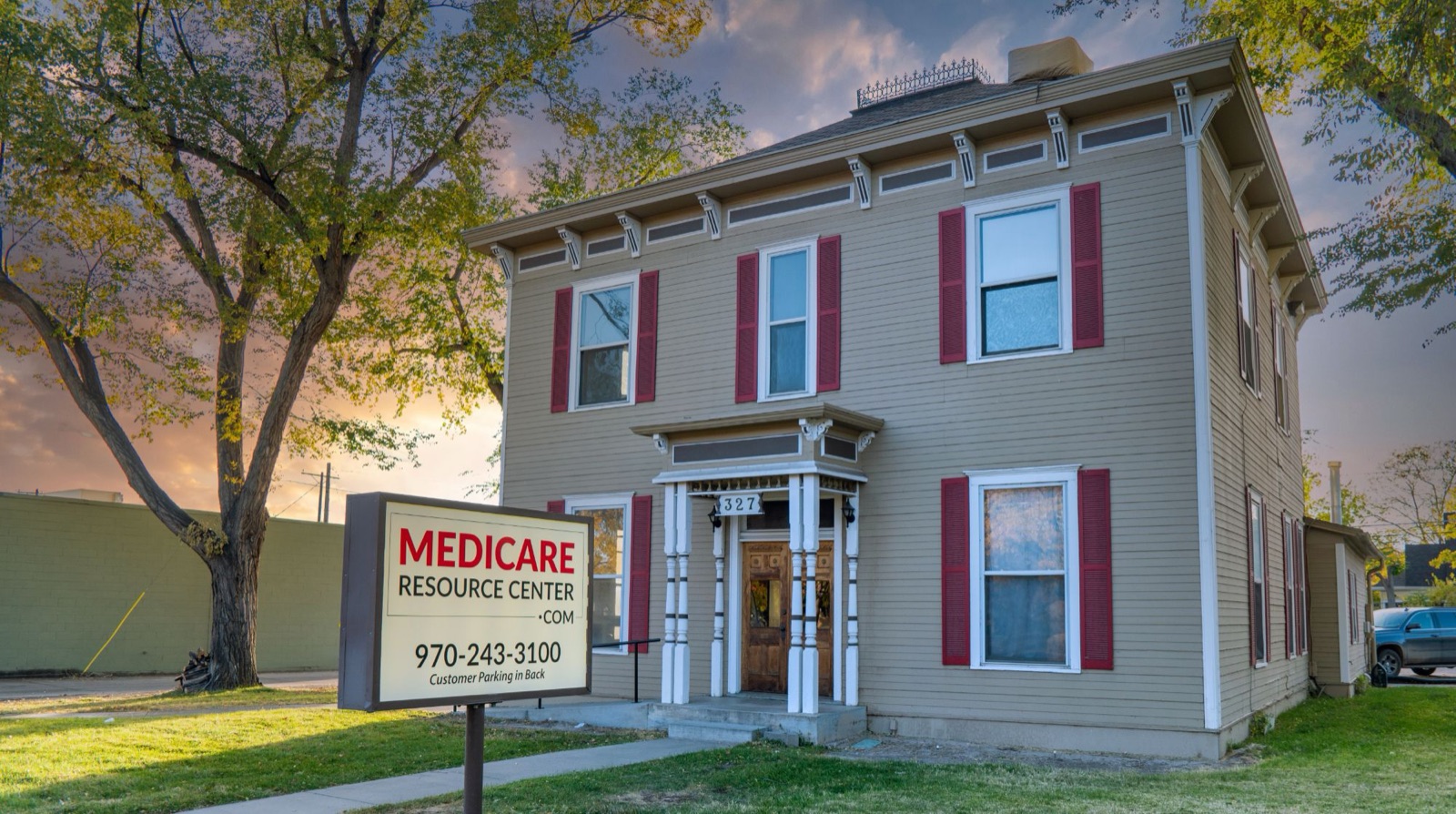 The Medicare Resource Center office at 327 North 7th Street in Grand Junction, a two-story building with a sign out front